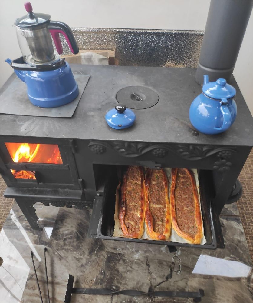 Traditional dish cooking on top and in the oven of a kuzine stove